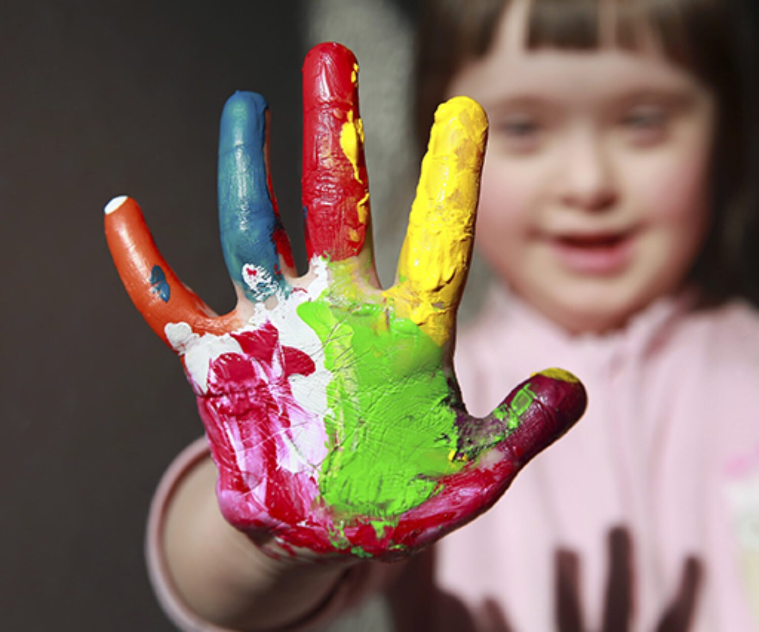 Cute little girl with painted hand